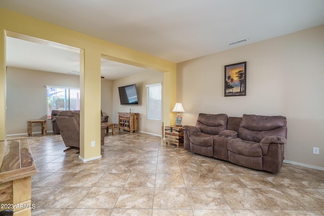 living room with light tile patterned flooring