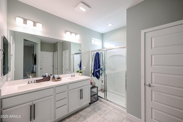 bathroom with vanity and a shower with shower door