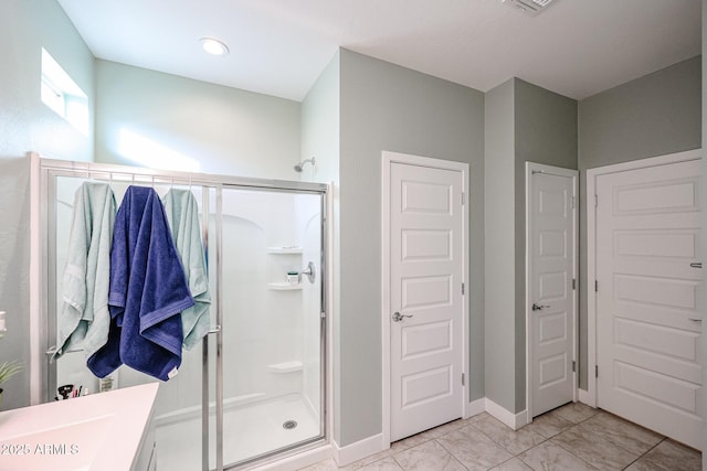 bathroom featuring vanity and walk in shower