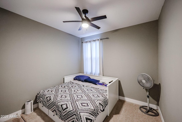 bedroom featuring light carpet and ceiling fan