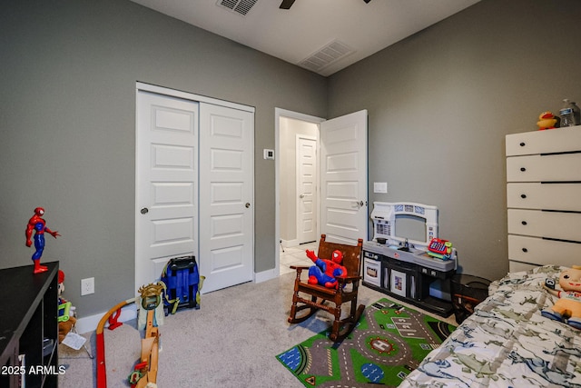 carpeted bedroom with a closet and ceiling fan