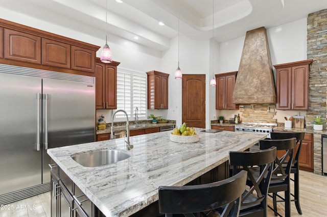 6146 E Dixileta Dr, Cave Creek, AZ 85331 - kitchen featuring custom exhaust hood, light wood-style floors, a high ceiling, a sink, and stainless steel built in refrigerator