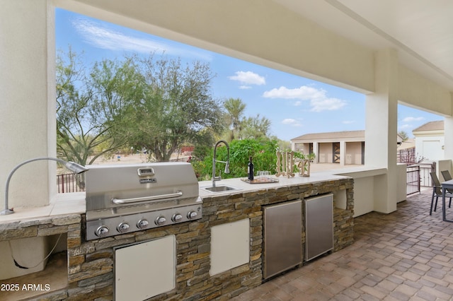 6146 E Dixileta Dr, Cave Creek, AZ 85331 - view of patio / terrace featuring grilling area, a sink, exterior kitchen, and an outdoor bar