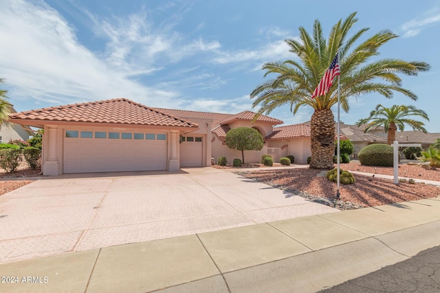 mediterranean / spanish house featuring a garage