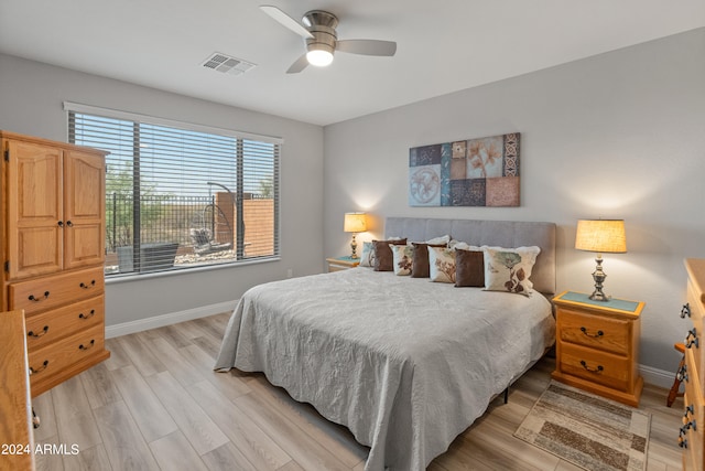 bedroom featuring light hardwood / wood-style flooring and ceiling fan