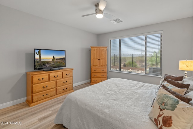 bedroom featuring light wood-type flooring and ceiling fan