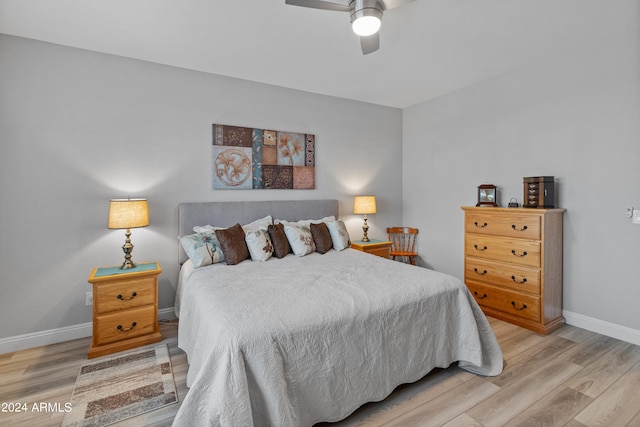 bedroom featuring ceiling fan and hardwood / wood-style flooring