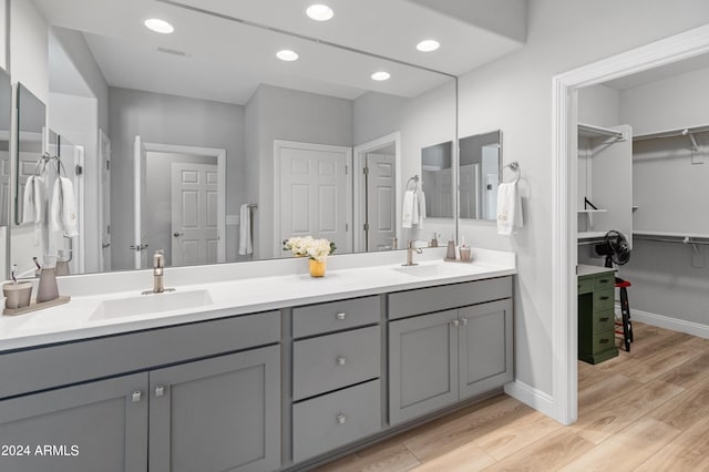 bathroom featuring wood-type flooring and vanity