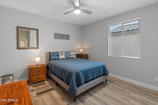 bedroom with light wood-type flooring and ceiling fan