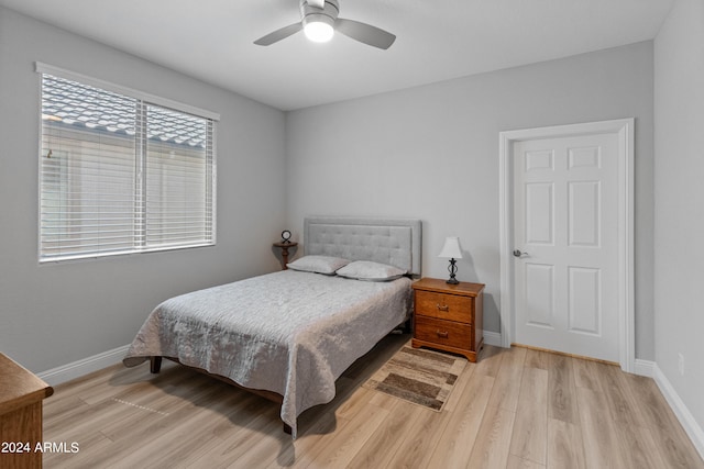 bedroom featuring light wood-type flooring and ceiling fan