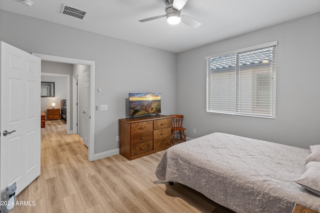 bedroom featuring ceiling fan and light hardwood / wood-style floors