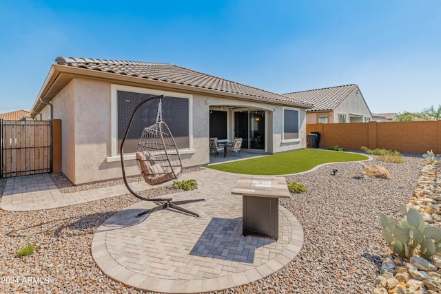 rear view of house featuring a patio area