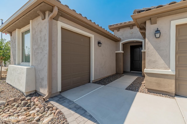 property entrance featuring a garage