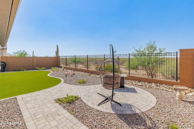 view of yard with a patio area and an outdoor fire pit