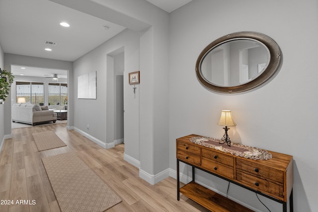 hallway featuring light hardwood / wood-style flooring