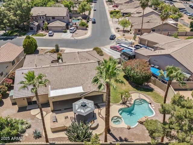 birds eye view of property with a residential view