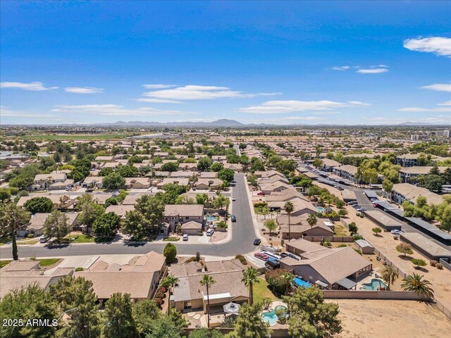 bird's eye view with a residential view and a mountain view