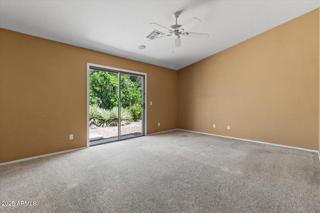 empty room featuring baseboards, ceiling fan, carpet flooring, and visible vents
