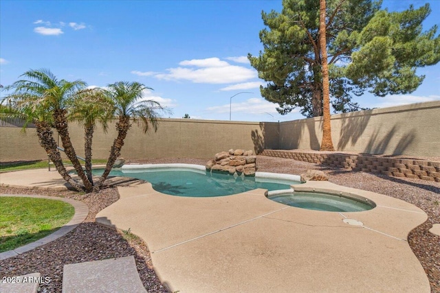 view of pool featuring a patio, an in ground hot tub, a fenced in pool, and a fenced backyard