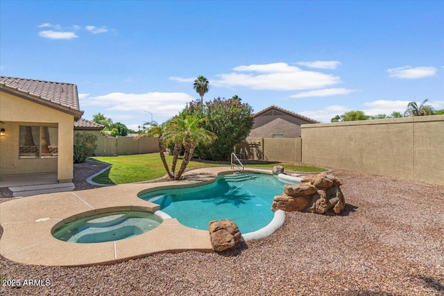 view of swimming pool featuring a fenced backyard, a yard, a patio area, and a pool with connected hot tub