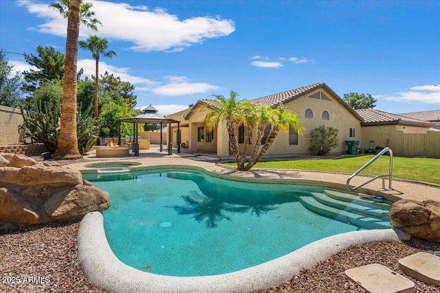 outdoor pool with an in ground hot tub, fence, a patio, and a gazebo