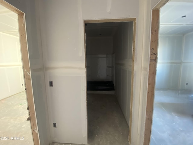 hallway featuring concrete flooring