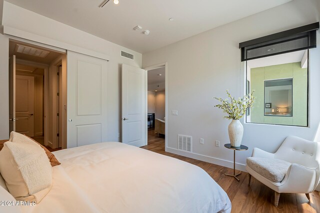 bedroom featuring dark hardwood / wood-style flooring