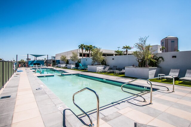 view of pool featuring a patio area