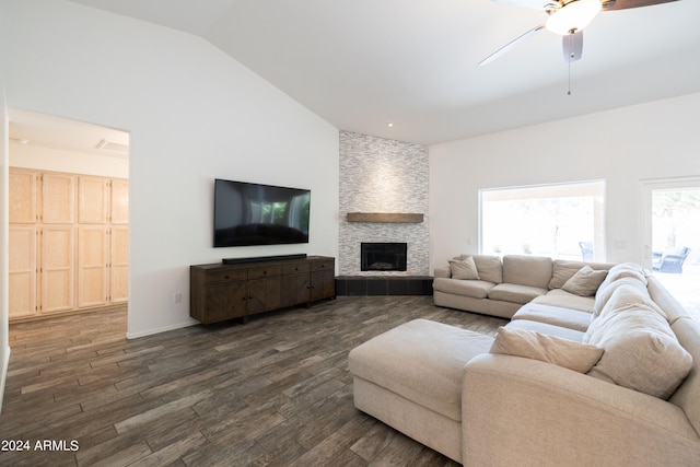 living room with ceiling fan, high vaulted ceiling, dark hardwood / wood-style flooring, and a fireplace