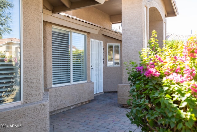 property entrance featuring a patio area