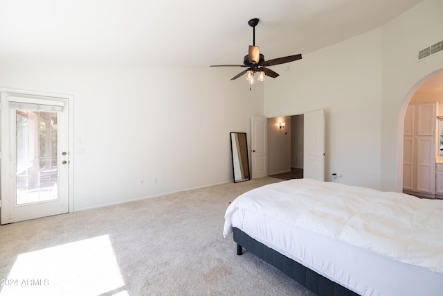 bedroom featuring access to outside, light colored carpet, high vaulted ceiling, and ceiling fan