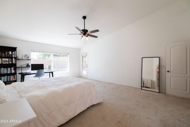 carpeted bedroom with ceiling fan and vaulted ceiling