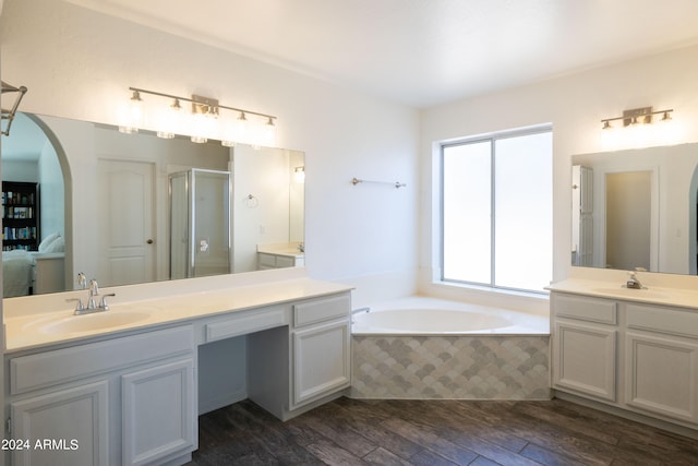 bathroom with vanity, shower with separate bathtub, and hardwood / wood-style flooring