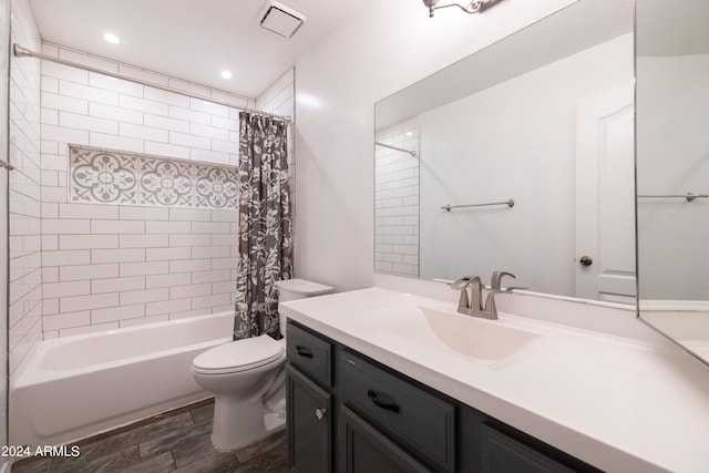 full bathroom featuring vanity, shower / bath combo, hardwood / wood-style flooring, and toilet