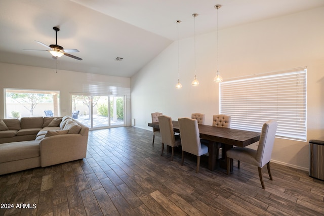 dining area featuring lofted ceiling, ceiling fan, and dark hardwood / wood-style flooring