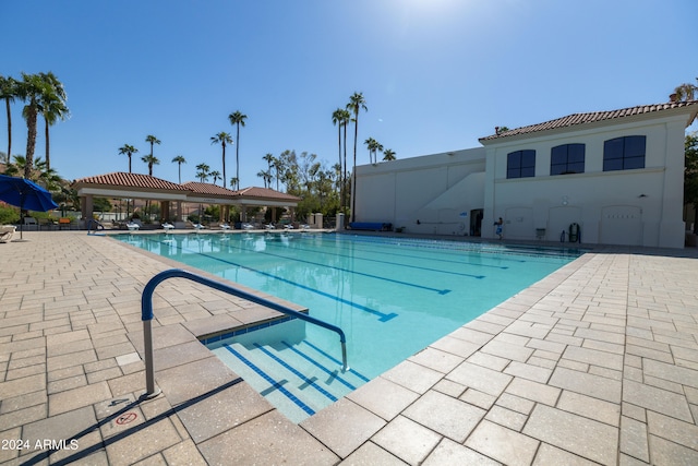 view of swimming pool with a patio area