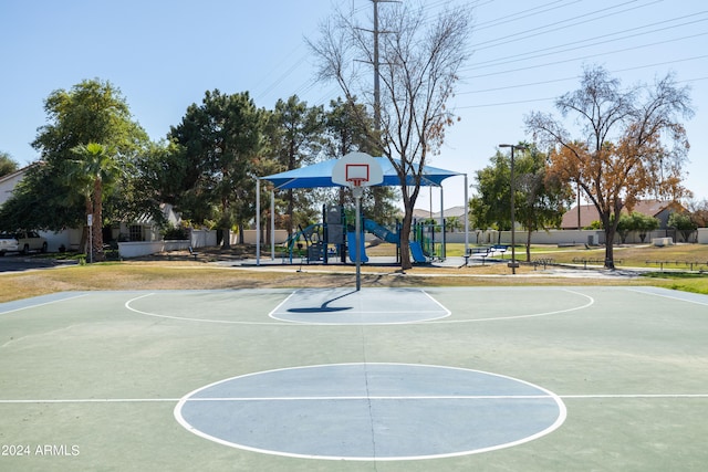 view of sport court featuring a playground