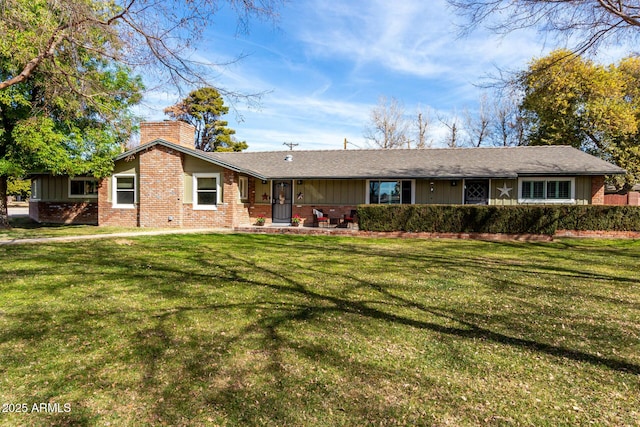 ranch-style home featuring a front yard