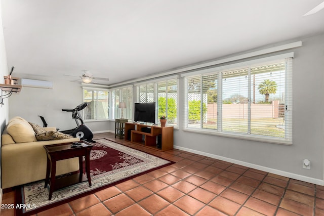 living room with ceiling fan, tile patterned flooring, and a wall unit AC