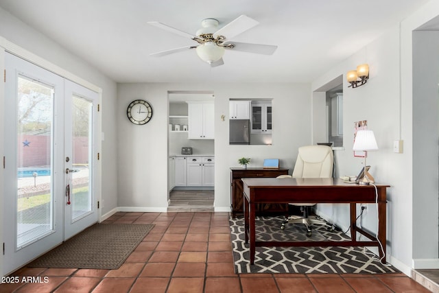 office featuring dark tile patterned floors, ceiling fan, and french doors