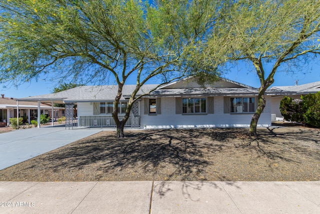 ranch-style home with a carport