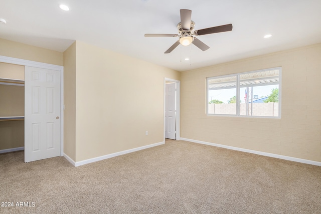 unfurnished bedroom with ceiling fan and carpet floors