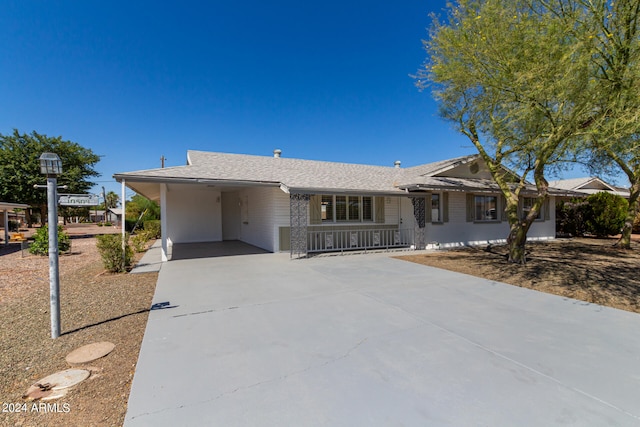 single story home with a carport