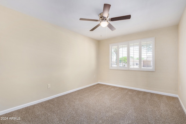 carpeted empty room with ceiling fan