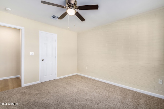 unfurnished bedroom with ceiling fan and carpet flooring