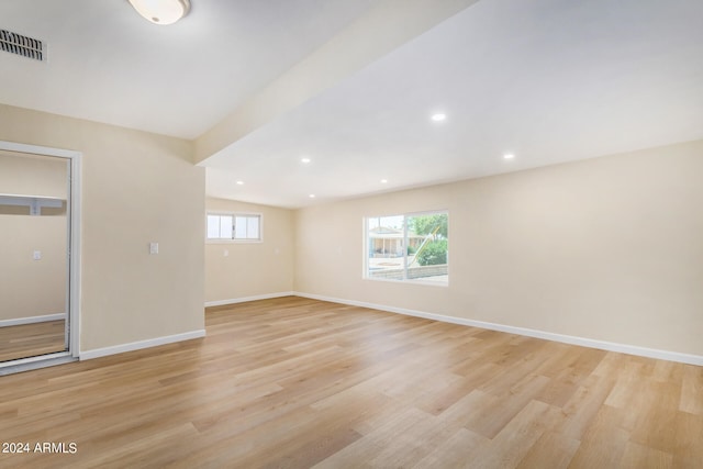 spare room with light hardwood / wood-style flooring