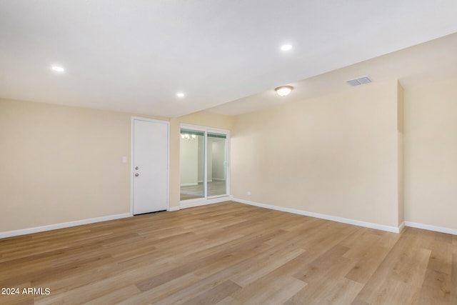 unfurnished room with light wood-type flooring