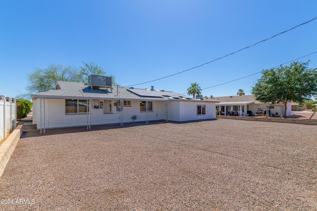 back of property with a patio and cooling unit