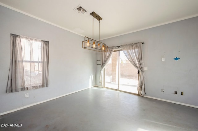 unfurnished room with crown molding and concrete floors