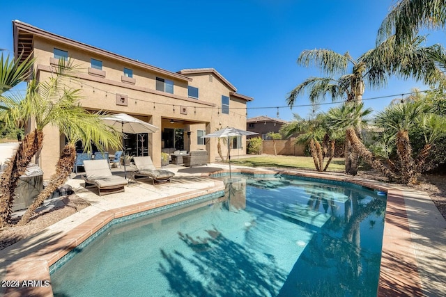 view of pool with a fenced in pool, a patio, and fence